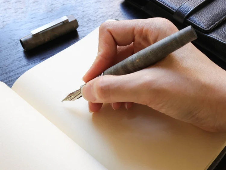 Olympus-Titanium-stabilized-fountain-pen-Wancher-writing.webp